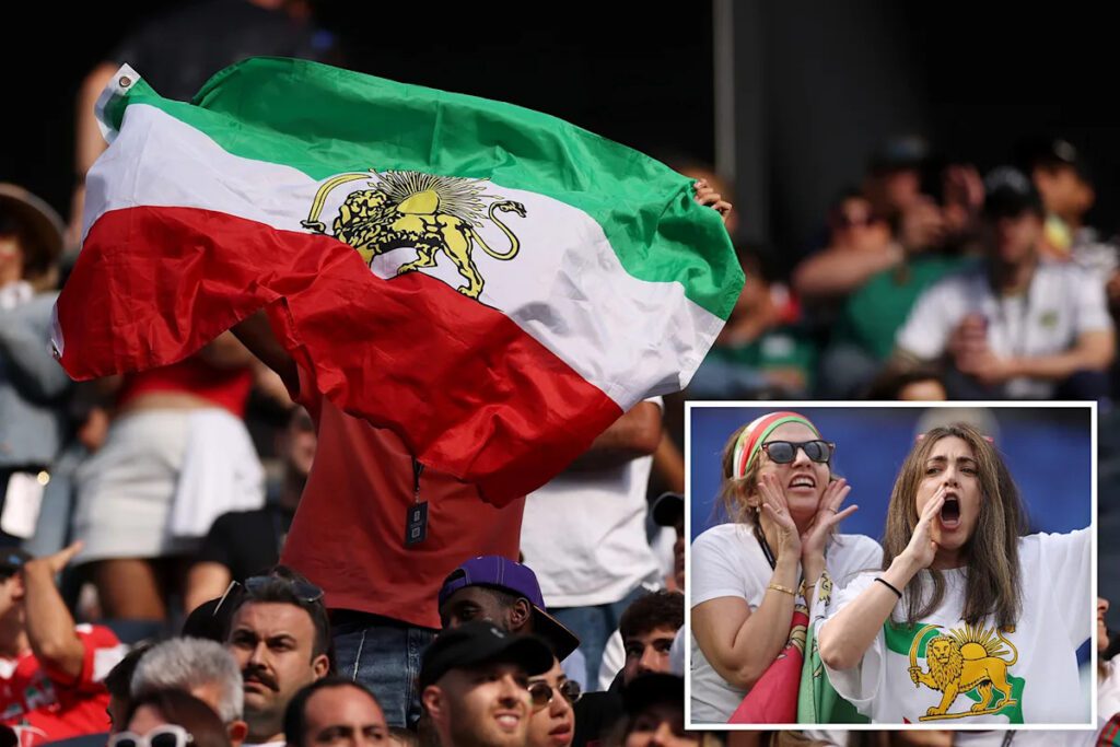 Iranian Fans Defy FIFA with Pre-Revolutionary Flags in World Cup Stadium Iranian Fans Defy Fifa With Pre Revolutionary Flags In World Cup